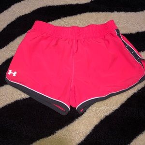 Bright pink Under Armour athletic shorts